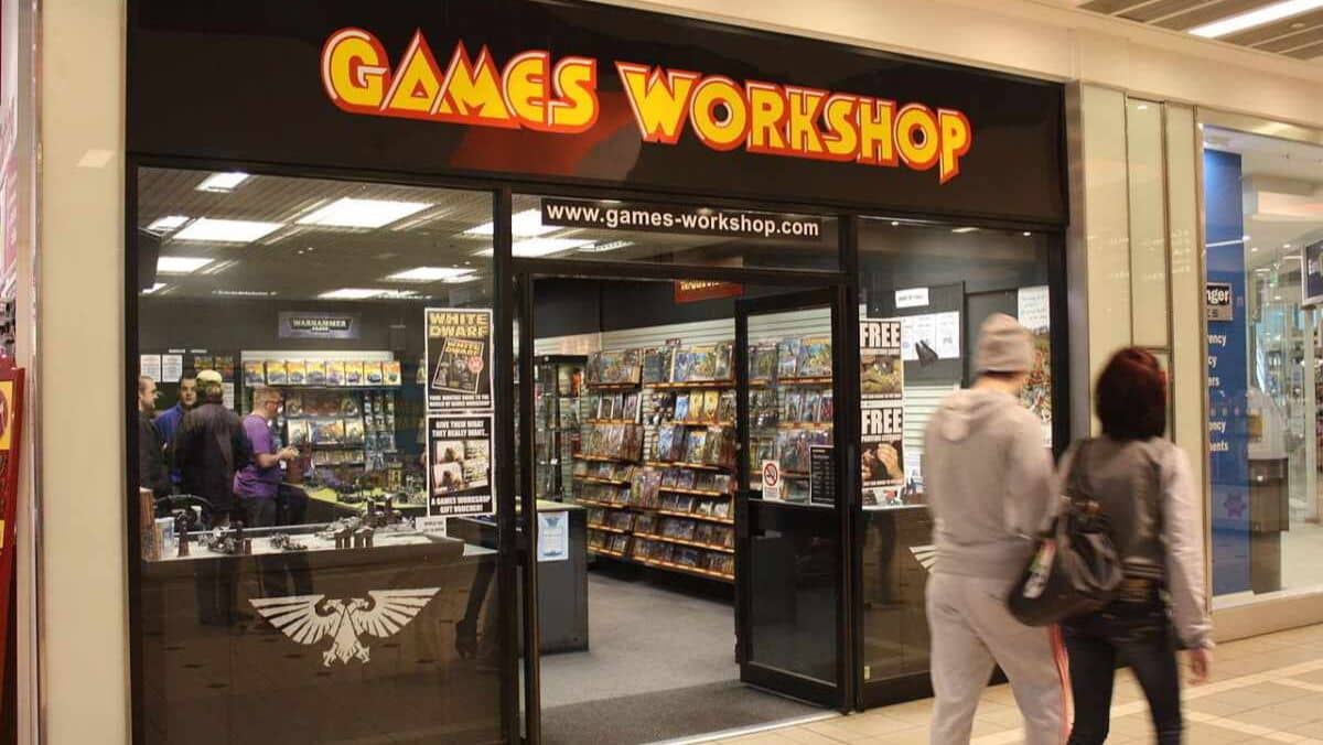A Game Workshop store with people strolling outside