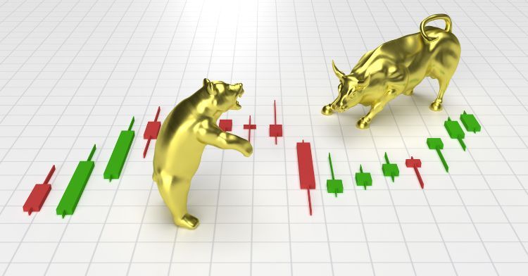 A conceptual 3D illustration of a gold bull and bear facing each other with candlestick stock market charts in the background.