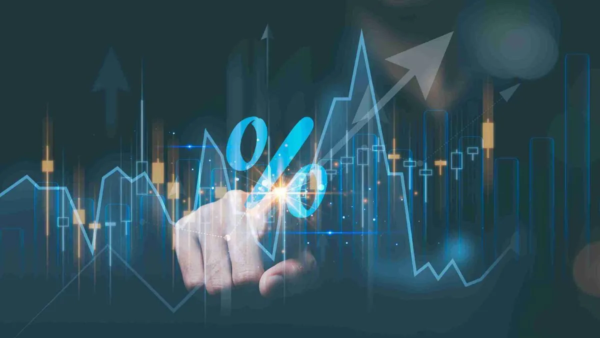 A person’s hand on a chart with an ascending arrow indicating an upward direction