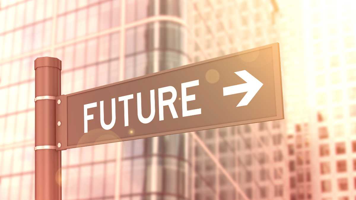 A signpost reads FUTURE with an arrow pointing right against a blurred cityscape