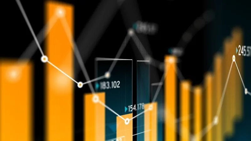 Close-up of a financial growth chart with bar graphs and line graphs..